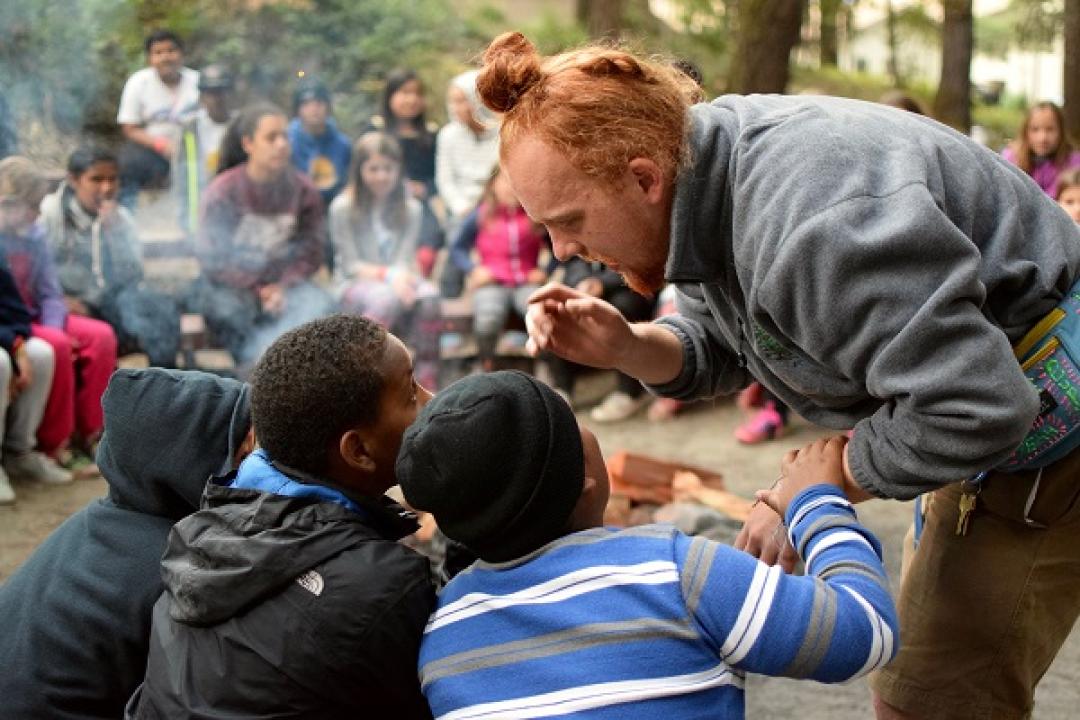 Staff talking to campers