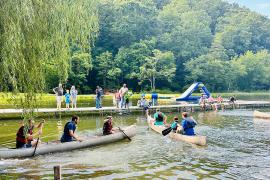 Families paddling in canoes