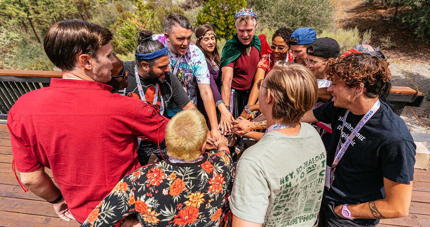 staff all placing hands in middle