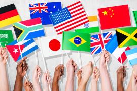 stock photo of hands holding flags from different countries