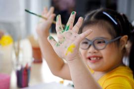 Girl with paint on her hands