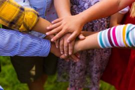 Children with hands together