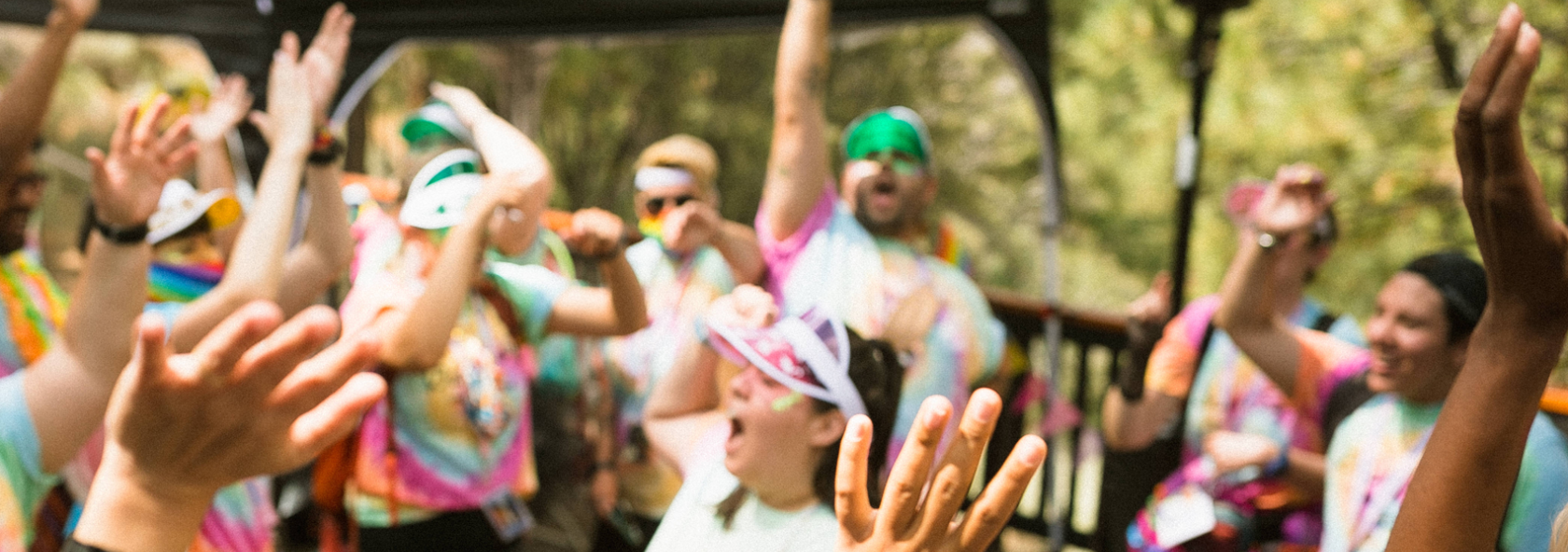 Camp Staff Cheering with Hands Raised