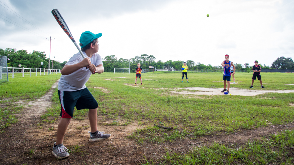 Group of campers playing baseball