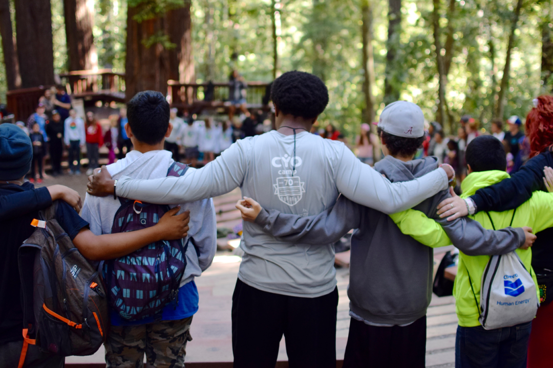 Group of staff and campers in a circle