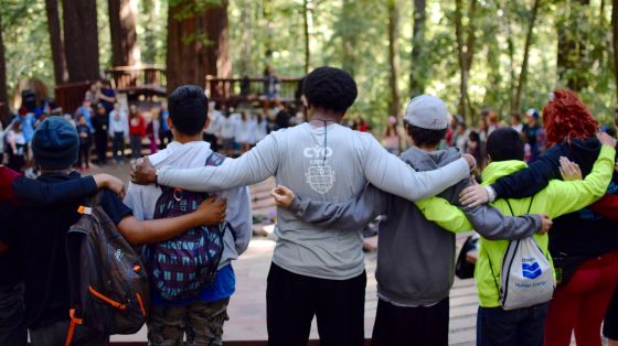 Group of staff and campers in a circle