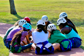 campers in a huddle