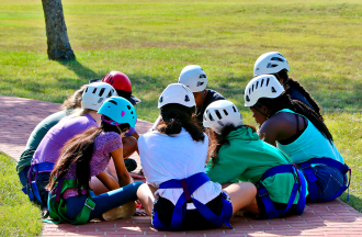 campers in a huddle