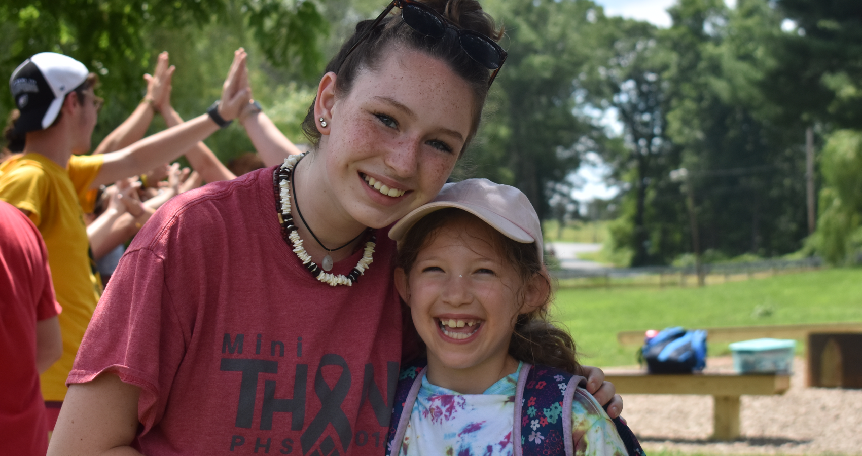 Counselor with camper smiling